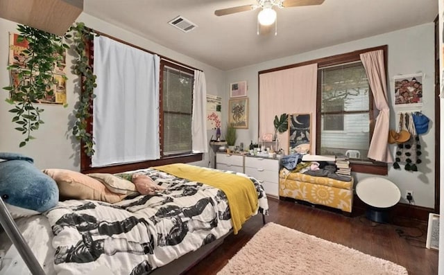 bedroom with visible vents, ceiling fan, and wood finished floors