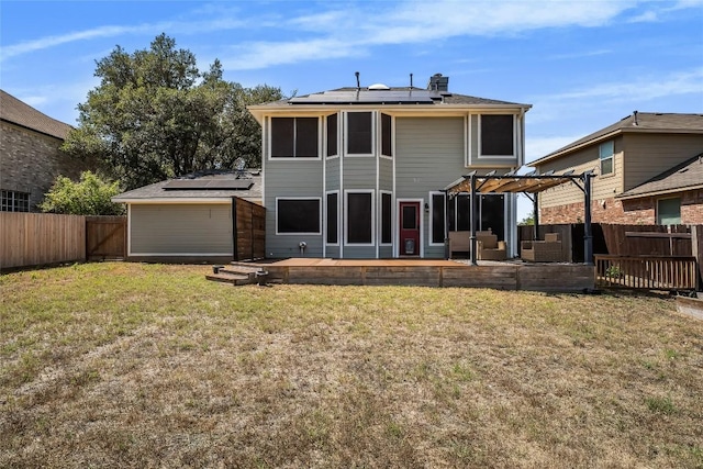 16901 W Stockton Dr, Leander, TX 78641 - back of property with solar panels, a pergola, a fenced backyard, and a deck
