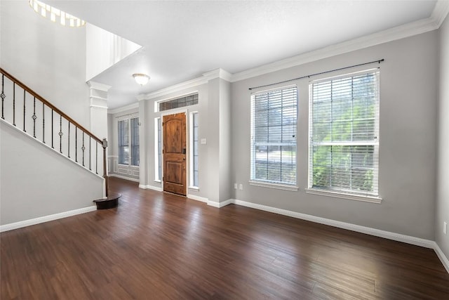 entryway featuring stairway, baseboards, wood finished floors, and ornamental molding