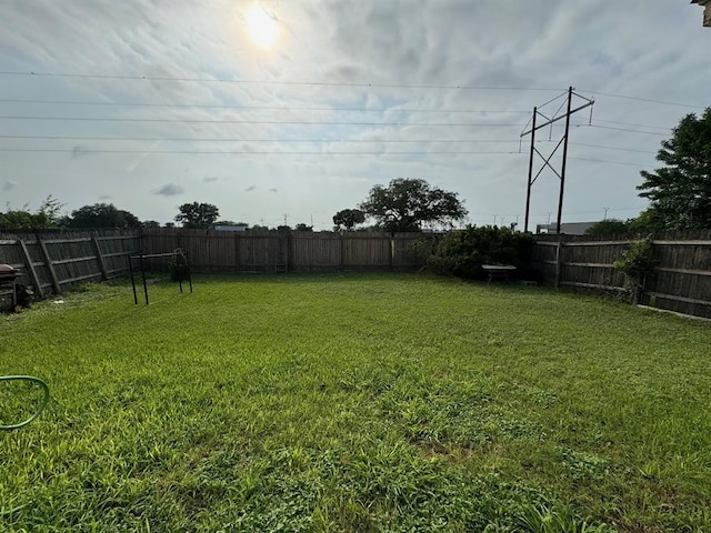 view of yard featuring a fenced backyard