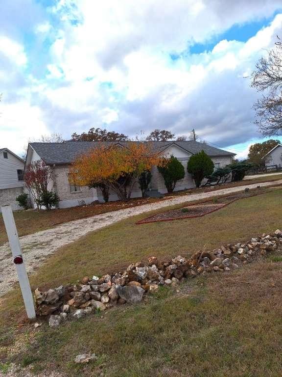 exterior space with a front lawn