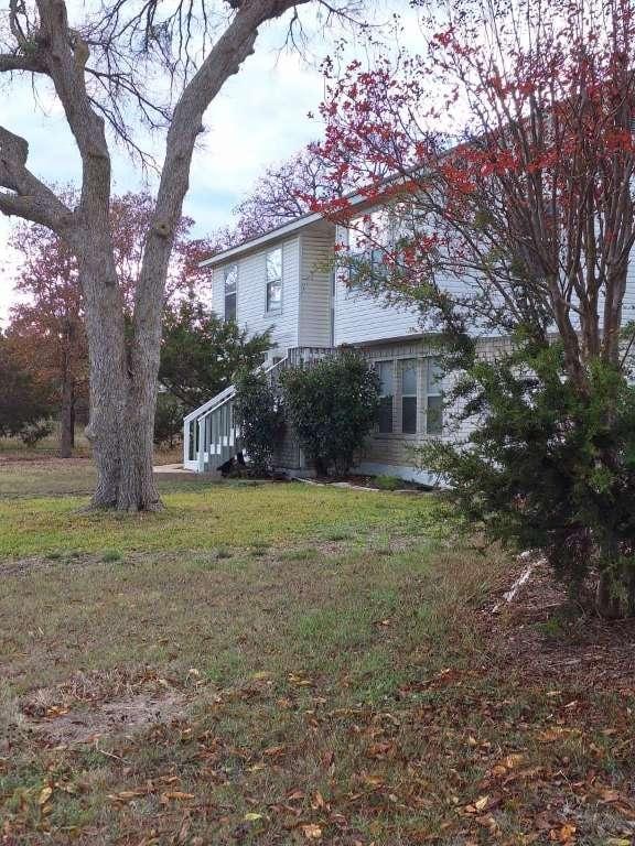 view of home's exterior featuring a lawn