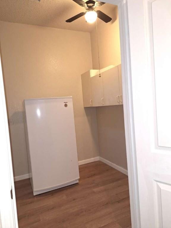 107 Patricia Rd, Georgetown, TX 78628 - laundry room with wood finished floors and ceiling fan