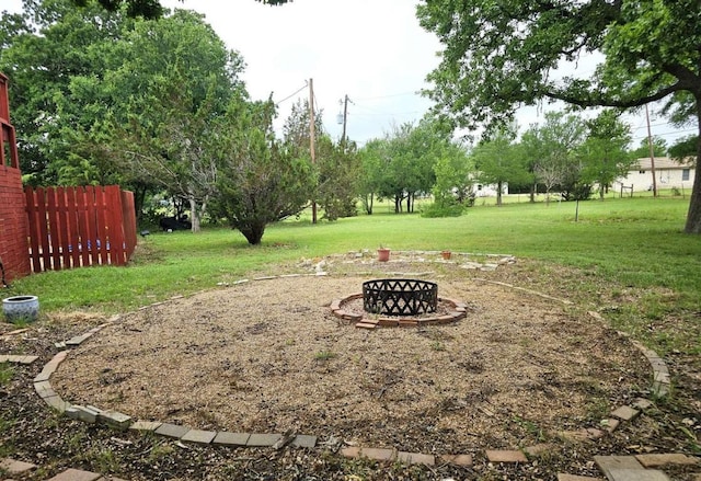 107 Patricia Rd, Georgetown, TX 78628 - view of yard featuring an outdoor fire pit