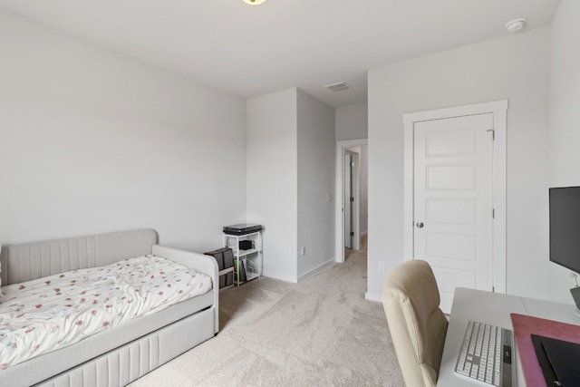 bedroom featuring visible vents, baseboards, and carpet floors