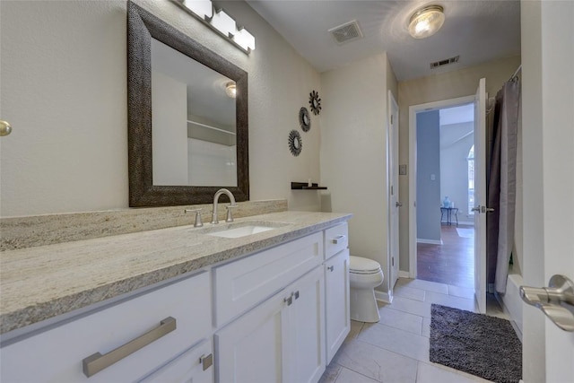 full bathroom with tile patterned flooring, visible vents, toilet, and vanity