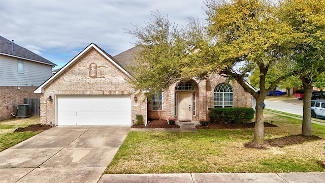 view of front of house featuring driveway, central AC, an attached garage, a front yard, and brick siding