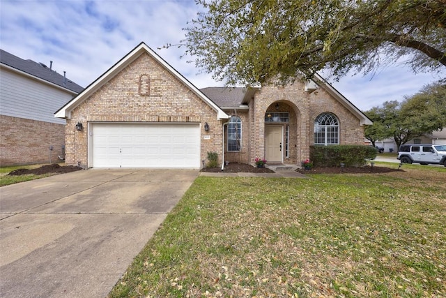 view of front of home featuring a front lawn, brick siding, concrete driveway, and an attached garage