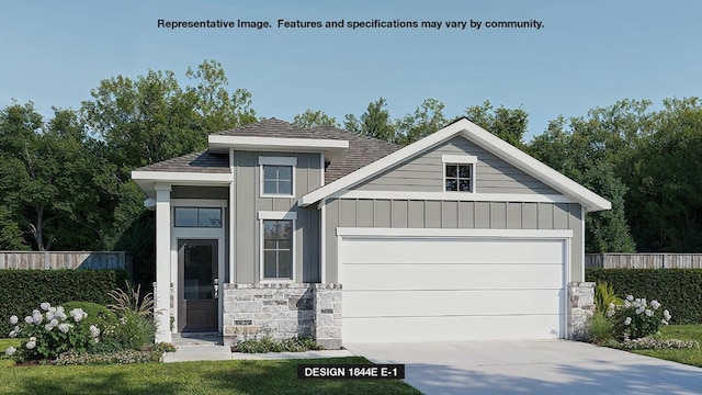 view of front of house featuring board and batten siding, fence, driveway, stone siding, and an attached garage