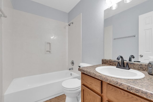 full bathroom with tile patterned flooring, toilet, vanity, and washtub / shower combination