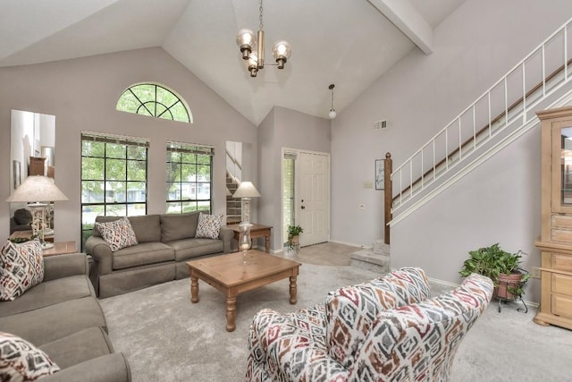 living area featuring stairway, carpet, visible vents, high vaulted ceiling, and a chandelier