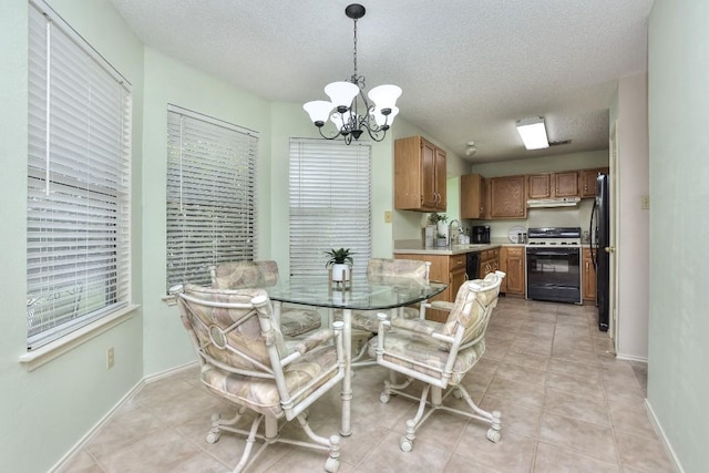 dining room featuring light tile patterned floors, baseboards, a notable chandelier, and a textured ceiling