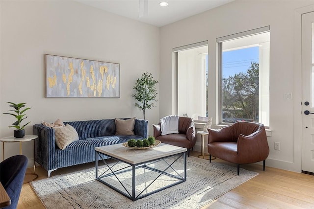 living room with recessed lighting, wood finished floors, and baseboards