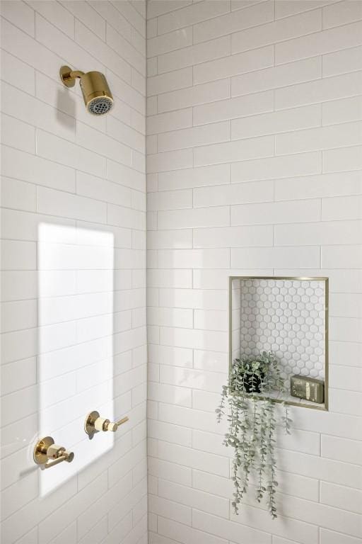 interior space with tiled shower