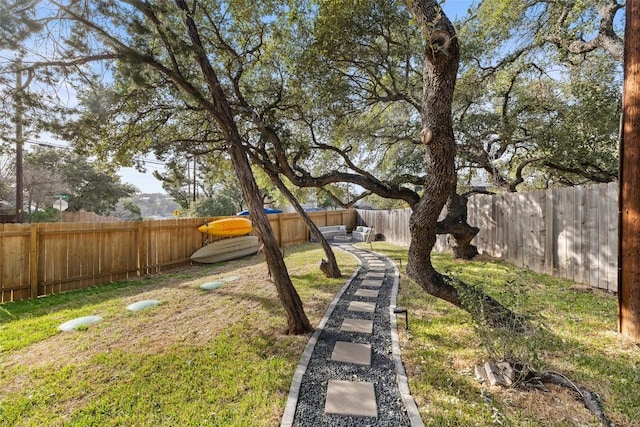 view of yard with a fenced backyard