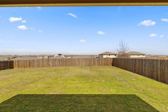 view of yard with a fenced backyard