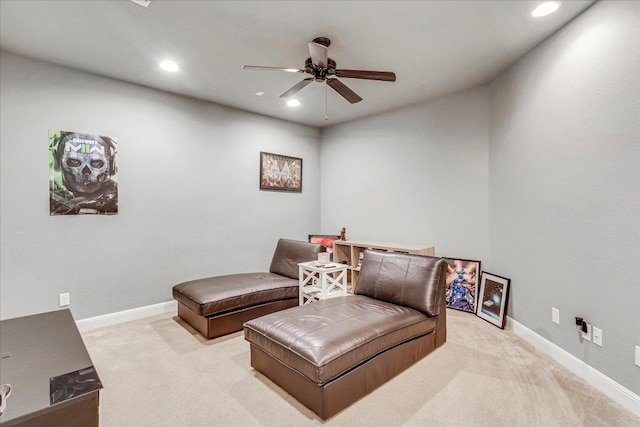 living area featuring light carpet, recessed lighting, baseboards, and ceiling fan