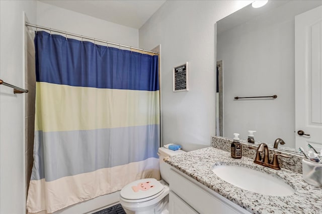 bathroom featuring visible vents, toilet, and vanity