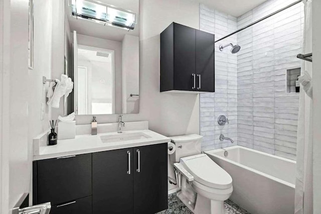 bathroom featuring toilet, vanity, and bathing tub / shower combination