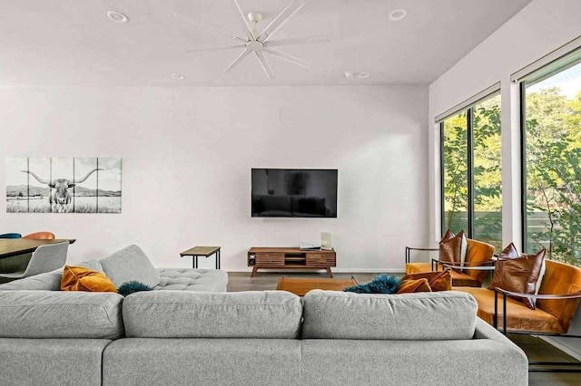 living area featuring wood finished floors and baseboards