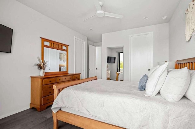 bedroom with a ceiling fan and wood finished floors