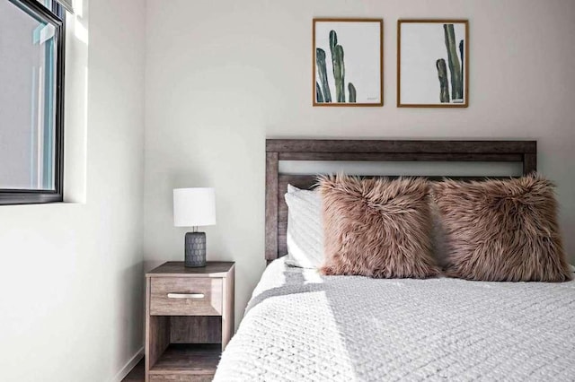 bedroom with wood finished floors