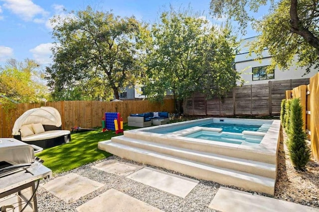 view of swimming pool with an in ground hot tub, a fenced backyard, and outdoor lounge area