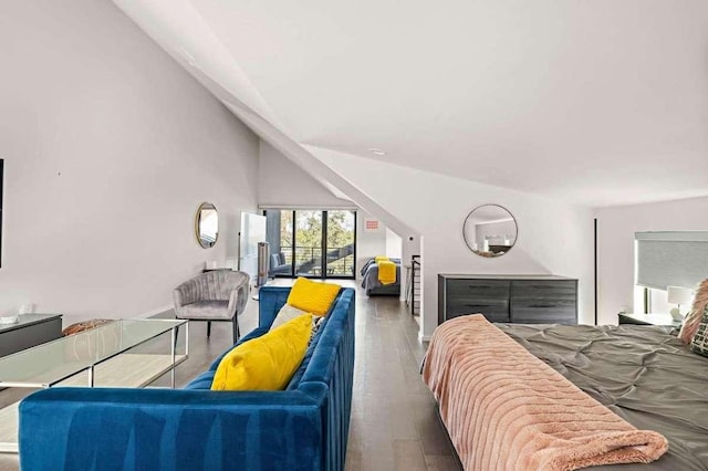 bedroom featuring vaulted ceiling and wood finished floors