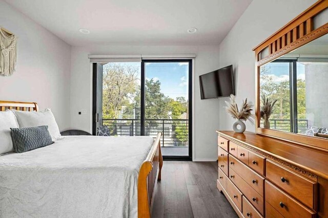 bedroom featuring dark wood-style floors and access to outside