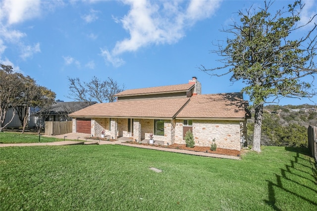 view of front of property featuring a front lawn, fence, and a chimney