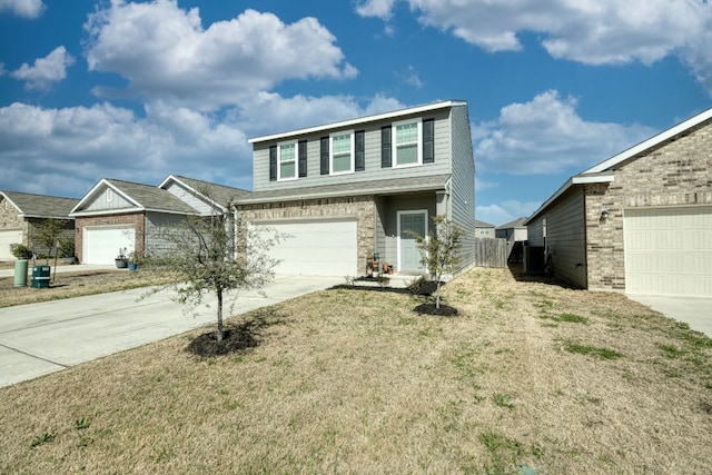 view of front of property featuring brick siding, concrete driveway, a front lawn, and fence