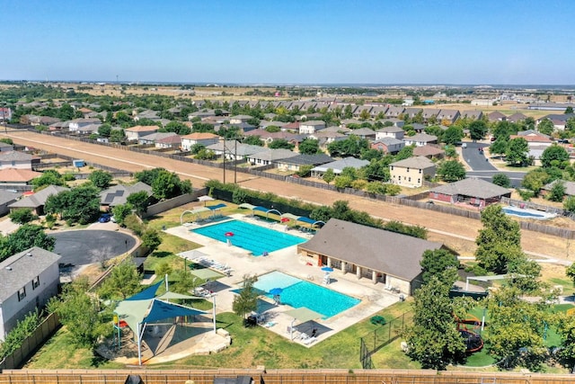 220 Wonderful Life Way, Jarrell, TX 76537 - aerial perspective of suburban area with a pool area
