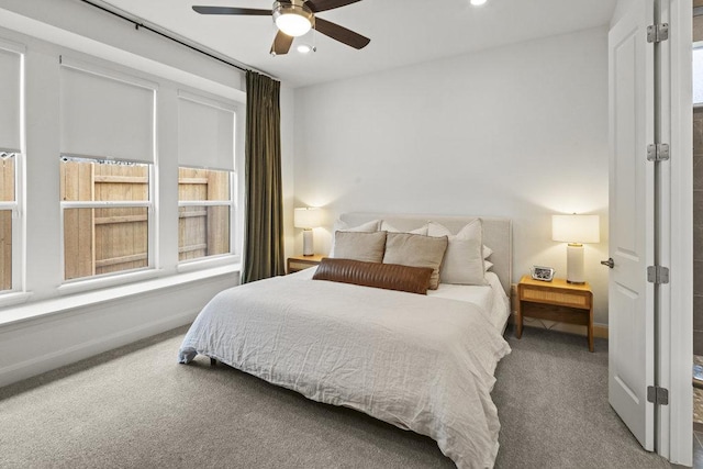 bedroom featuring carpet flooring, baseboards, and ceiling fan