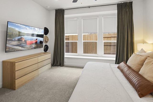 bedroom with multiple windows, carpet floors, and ceiling fan