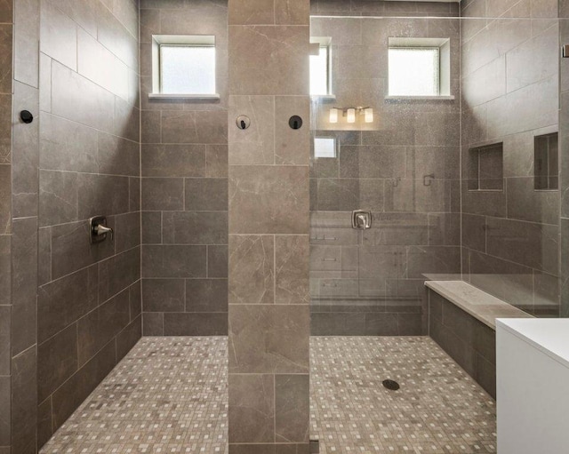 bathroom featuring a tile shower