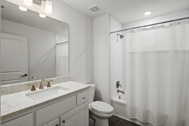 full bathroom featuring tile patterned floors, visible vents, shower / bathtub combination with curtain, toilet, and vanity