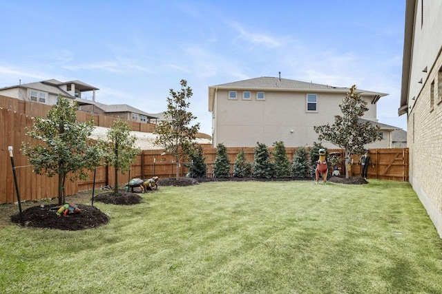 view of yard with a fenced backyard