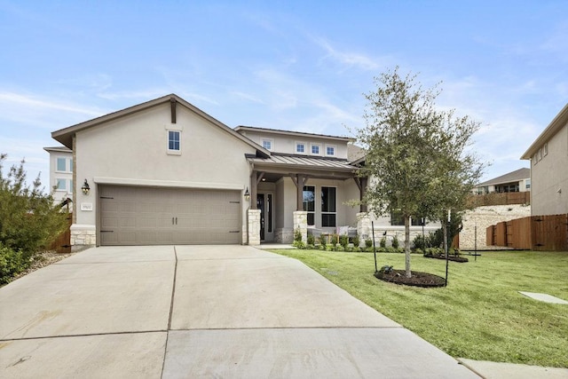 view of front of home featuring a standing seam roof, fence, concrete driveway, a front yard, and metal roof