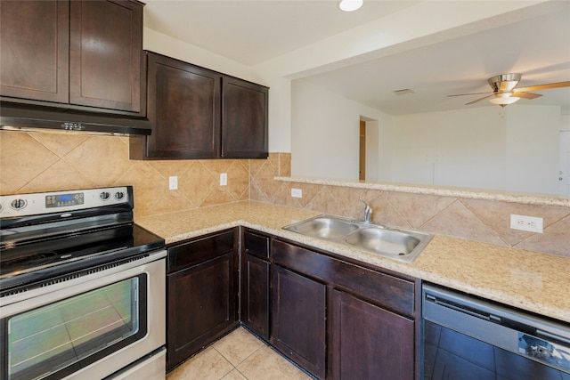 kitchen featuring under cabinet range hood, light countertops, dishwashing machine, electric range, and a sink