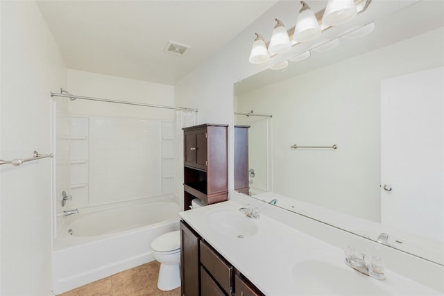 bathroom with double vanity, visible vents, toilet, and a sink