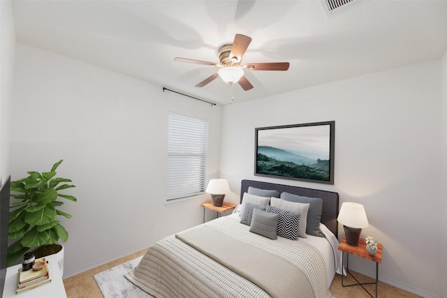 bedroom with visible vents, baseboards, and a ceiling fan