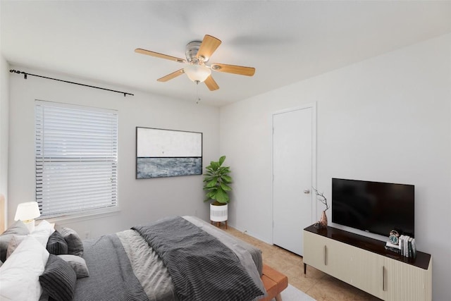 bedroom featuring light tile patterned floors and a ceiling fan