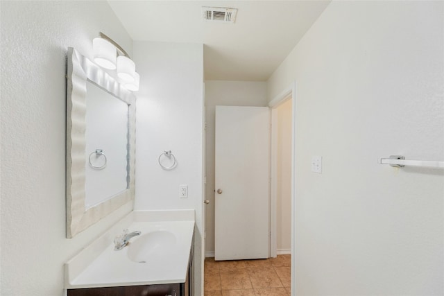 bathroom featuring visible vents, vanity, and tile patterned flooring