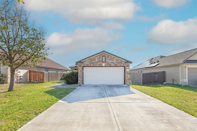 view of front of house featuring fence, concrete driveway, an attached garage, a front yard, and brick siding