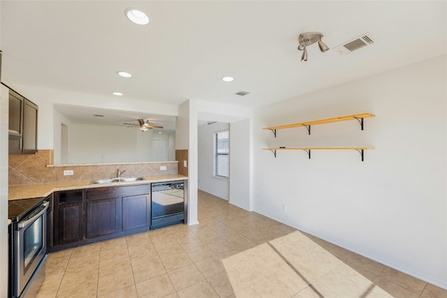 kitchen with dishwashing machine, visible vents, stainless steel electric stove, a sink, and tasteful backsplash