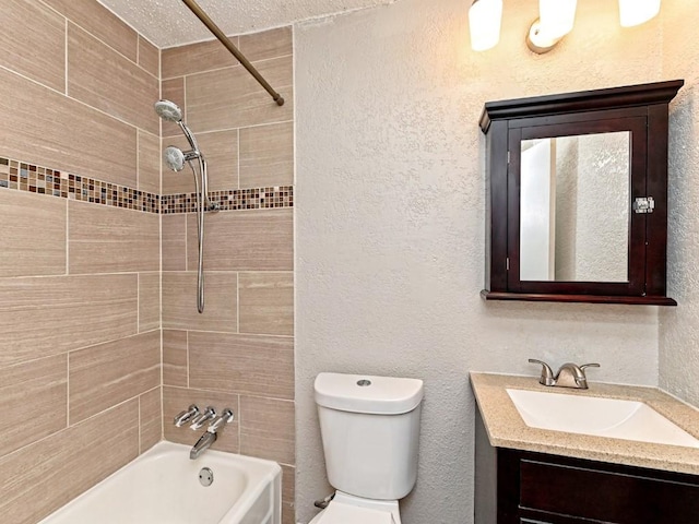 full bathroom featuring bathtub / shower combination, toilet, vanity, and a textured wall