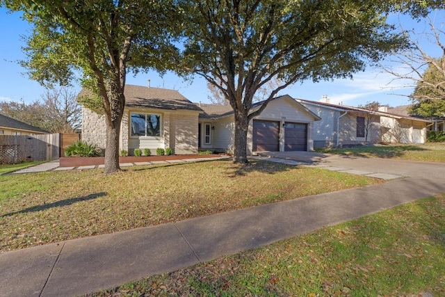 ranch-style house with an attached garage, concrete driveway, a front lawn, and fence