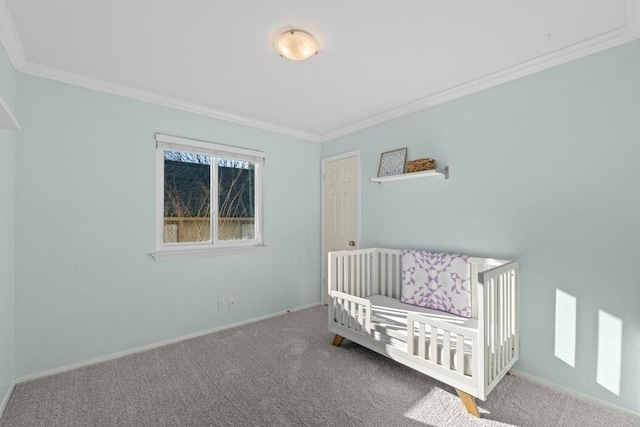 unfurnished bedroom with carpet, baseboards, and ornamental molding