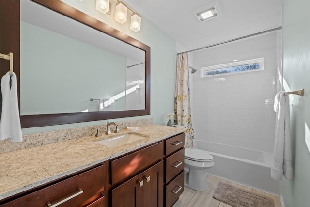 bathroom featuring visible vents, shower / bath combination with curtain, toilet, and vanity