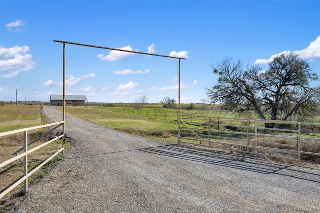 700 County Road 466, Elgin, TX 78621 - view of dirt / gravel driveway with a rural view